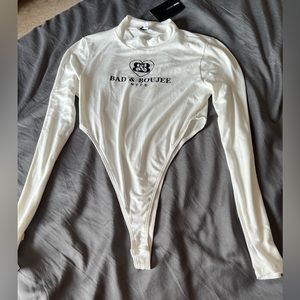 Fashion Nova white boujee high cut bodysuit. Size large.